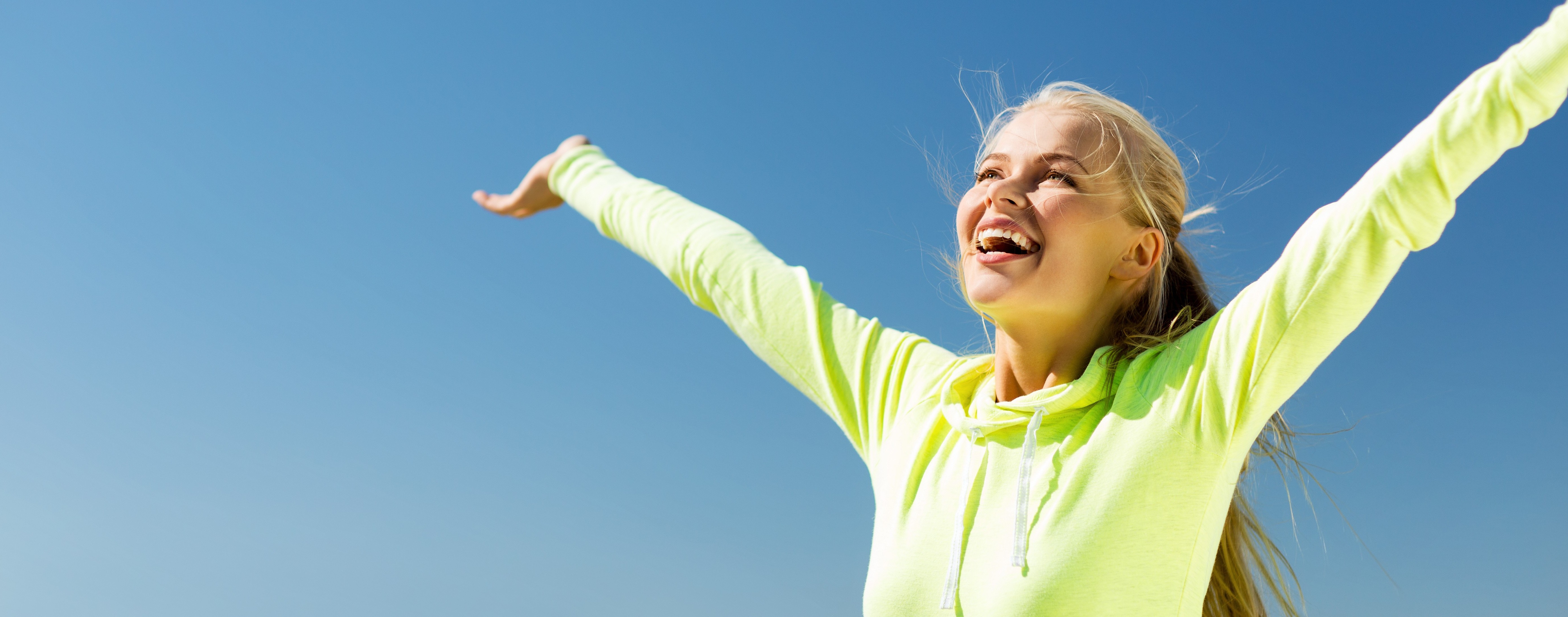 Sun is good for your health, sport and lifestyle concept - woman doing sports outdoors
